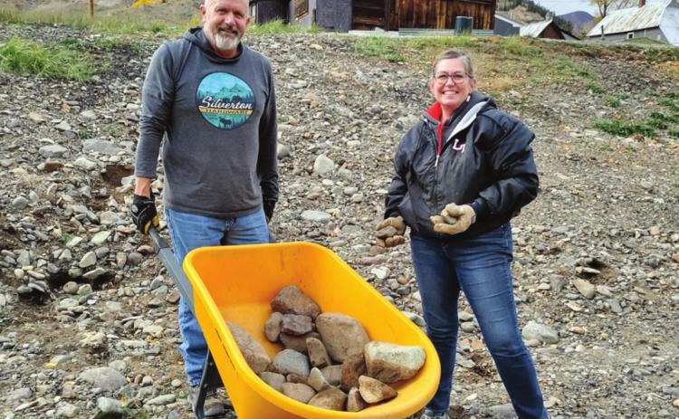 Silverton Hardware owners Dana and Jerry Chambers help move rocks at the Animas River Trail Workday. Photo Credit Danya Kranker
