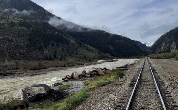 Train tracks leading to summer Photo by Scott Fetchenhier