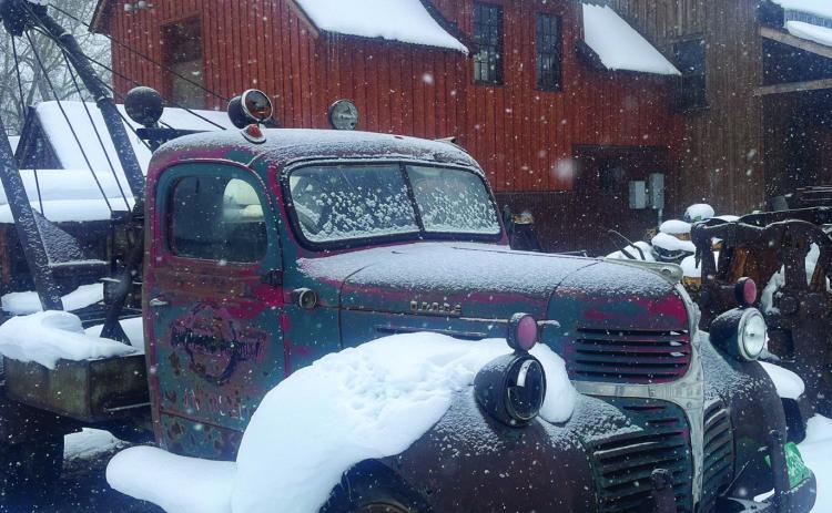 Photo credit Scott Fetchenhier Just a dusting of snow on the antique trucks outside The Mining Heritage Museum.