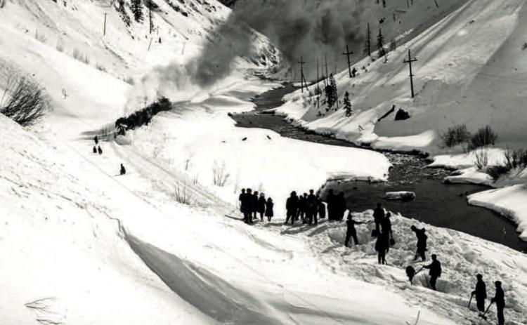 An undated post card of snow clearing on a slide along the Denver and Rio Grande Railroad south of Silverton. Menare hand-shoveling while passengers have walked to make a connection to a south-facing train beyond the slide. Photo courtesy of San Juan County Historical Society