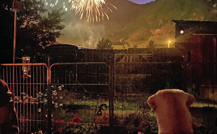 Locals enjoying the fireworks from their front porch. Photo credit Angela McCartney