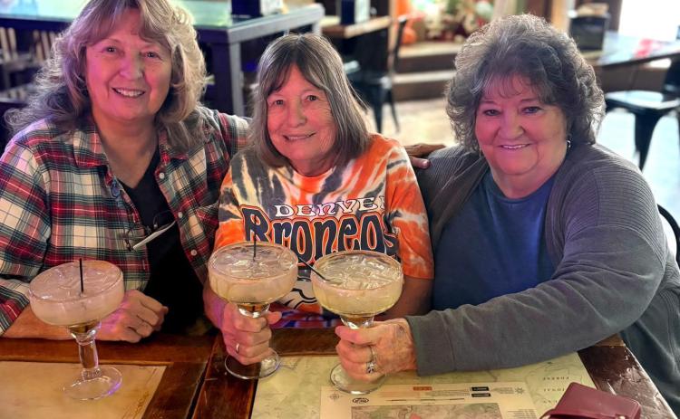 Longtime locals and multi-generational family Bingel sisters Charla Bingel Andreatta, Sue Bingel Sanders, and Patty Bingel enjoy the New Year, celebrating with the Alpine Tavern’s Gingerbread Margaritas photo by Charla Andreatta