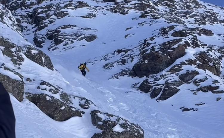 Silverton Mountain Guide Calvin Davenport drops in the chute photo by Silverton Mountain