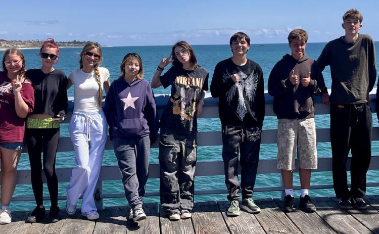 (L to R) Ixareli Angeles, Valentina Fierro, Brynn Hamm, Patience Rhoades, Renata Rosales, Sarah Lowrance, Marie Melcher, Jordan Perez, Elliot Barsczc, Liam Joyce, Richard Lowrance, Reid Weller during their recent school trip to San Diego where they interviewed a professional podcaster. (Missing from photo: Alayna Hamm, Vicky Quintana &amp; Alan Alvidrez)