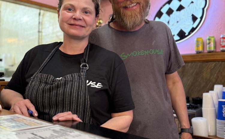 photo by DeAnne Gallegos Sherie and Chris Martin of T’s Smokehouse were happy to be open for the summer