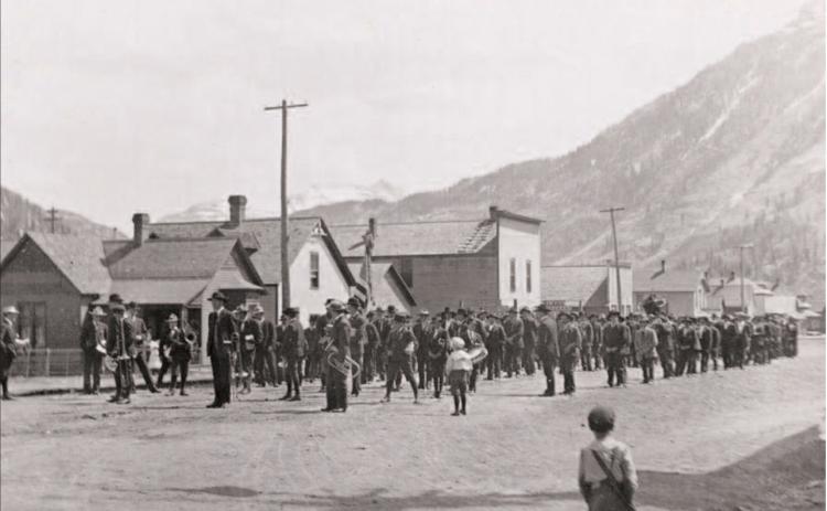 In the top photo, union men form on the 1000 block of Greene Street to march to the cemetery in June 1908 following the deaths of six miners in a fire at the Gold King Mine at Gladstone. A boys band lined up in front of the miners’ group. In the background can be seen the old Alamo Hotel and Curry’s store building. Photos courtesy of San Juan County Historical Society