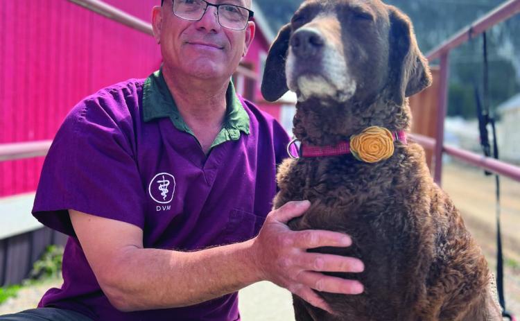 Dr Joe Alaimo with Diesel Dog at Senior Center. Photo credit DeAnne Gallegos