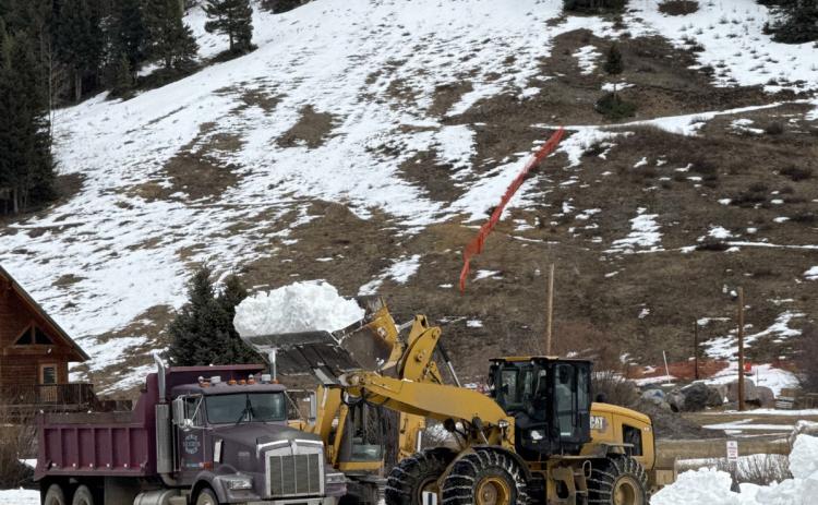 Public works crew started moving snow on Tuesday to make the Skijoring course photo by DeAnne Gallegos