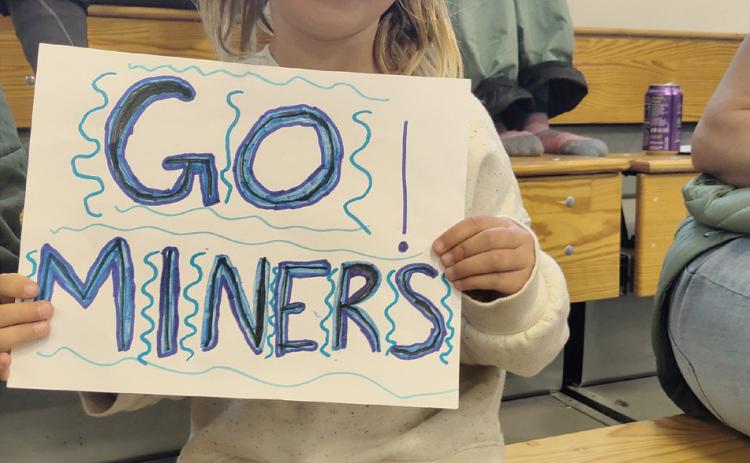 Photo credit Dave Emory. #1 Miner's fan, Willow Blakenship, shows her support.