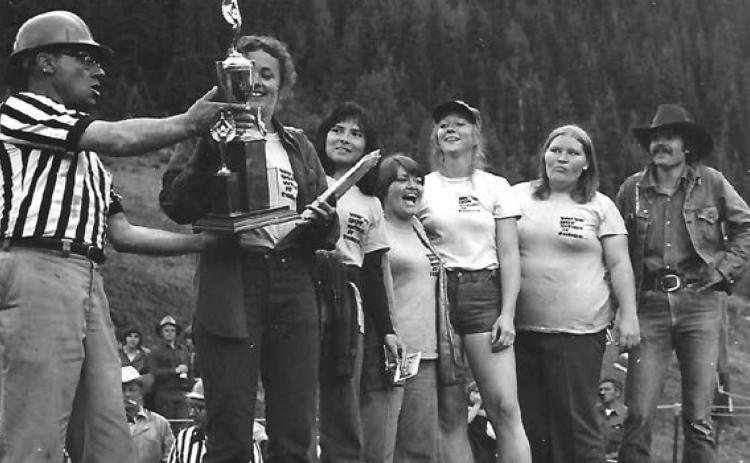 The 2021 Hardrockers Holidays is honoring the memory of Marilene Bovee, center, member of the Timberline Tubbies team. They’re receiving a trophy for winning first-place, tug-o-war.
