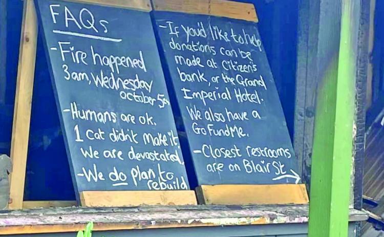 Signs in front of the destroyed Silverton Square Café. Photo Credit: Silverton Area Chamber of Commerce
