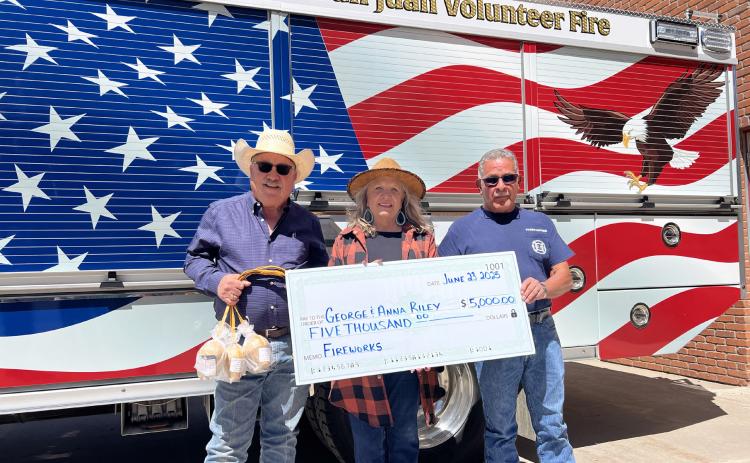 George and Anna Riley (left) donated $5,000 to the Silverton San Juan Volunteer Fire Department towards the fireworks show. Fire Chief Gilbert Archuleta (right side) accepted the check on behalf of the volunteer fire members. Photo credit DeAnne Gallegos