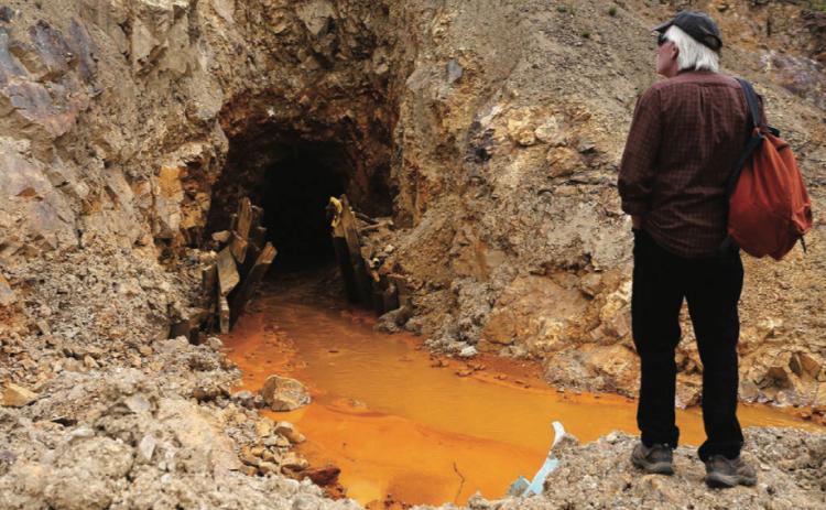San Juan County Commissioner Pete McKay examines the Gold King 7 portal above Gladstone on Monday Aug 10 2015 photo by Farmington Times