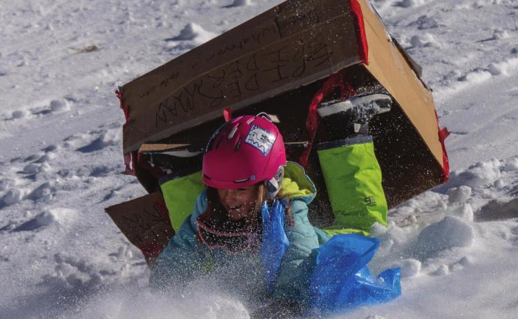 In a picture perfect Derby moment, Sophi Christensen eats snow with a smile. Photo Credit Wesley Berg