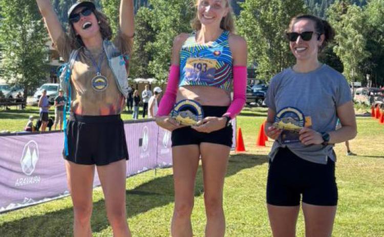 The top three female competitors on the podium. Photo credit Arvapai Running