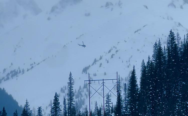 Helicopter heading into the Middle Fork of Mineral Creek to recover avalanche victim. Photo credit DeAnne Gallegos