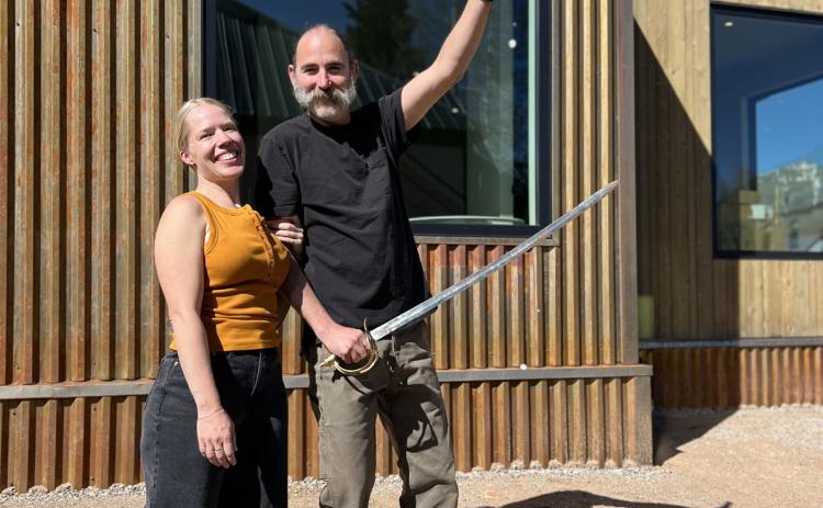 Photo credit DeAnne Gallegos Silverton locals Allyn Robinson and Angelo Colletti celebrate their new home build and move in day with the tried and true tradition of swording the champagne bottle.