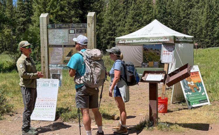 SJMA Forest Ambassador connecting with visitors at Ice Lake Trailhead photo by SJMA