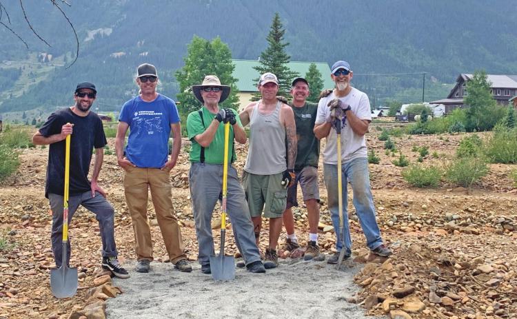 Volunteers for the SingleTrack Society have helped build and mark the trails. Over the weekend, volunteers moved several tons of rocks. Photo Credit Todd Bove