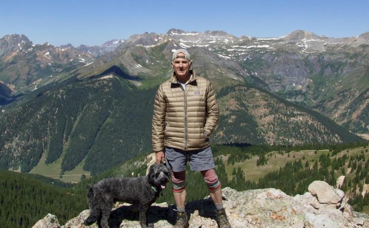 Jeff Burch on top of Ohio Peak just north of Silverton with his dog Photo by Jeff Burch