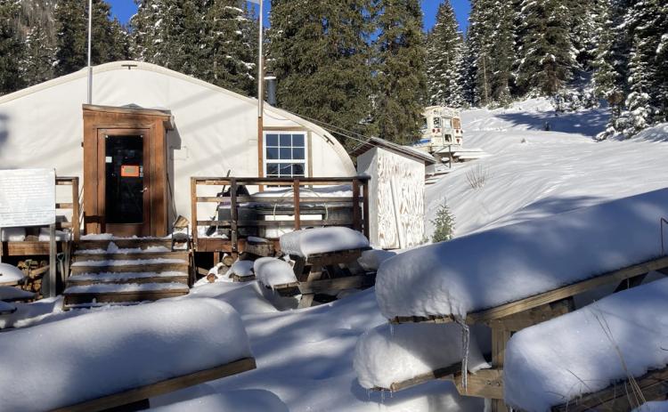 The ski area Silverton Mountain’s yurt and picnic tables are starting to pile up with fresh snow Photo by Hillary Cable