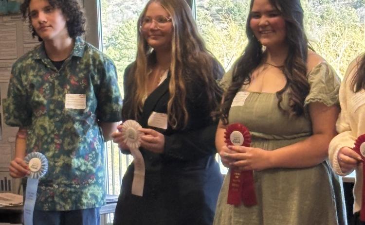 Brynn Hamm is in middle of the three students who competed photo by Silverton School