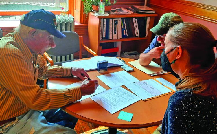 Dave Zanoni, George Zanoni and Town Administrator Gloria Kaasch-Buerger facilitating the closing on the land. Photo Credit Town of Silverton