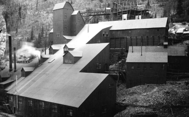 Ore processing buildings on a steep slope in San Juan County, Colorado. This Iowa Mill complex consists of multi-story, frame stamp mill buildings, smokestacks and support structures located in the Arrastra Basin near Silverton, Colorado. Benjamin W. Thayer and James H. Robin were involved in the development and operation of this facility in the late 1880s and 1890s. Photo Courtesy of Cindy Buckner