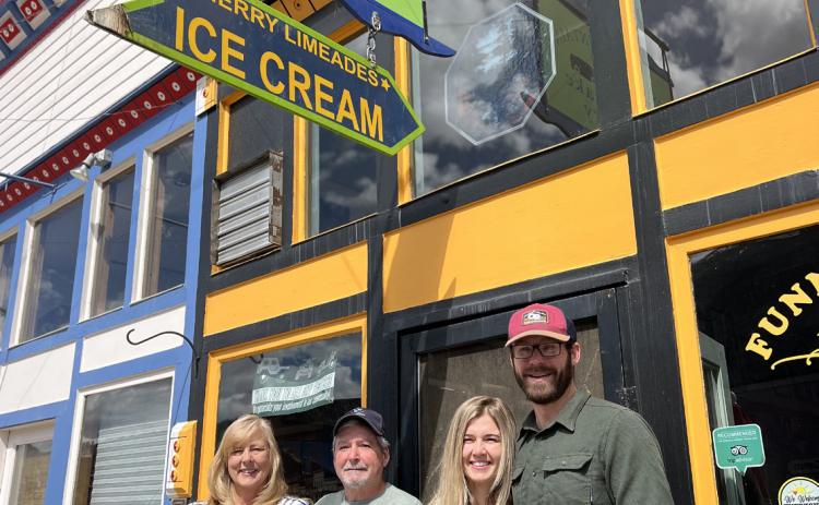 Former owners Tom and Lisa Davis with new owners Lauren Swoboda and Adam Galt. Photo credit DeAnne Gallegos