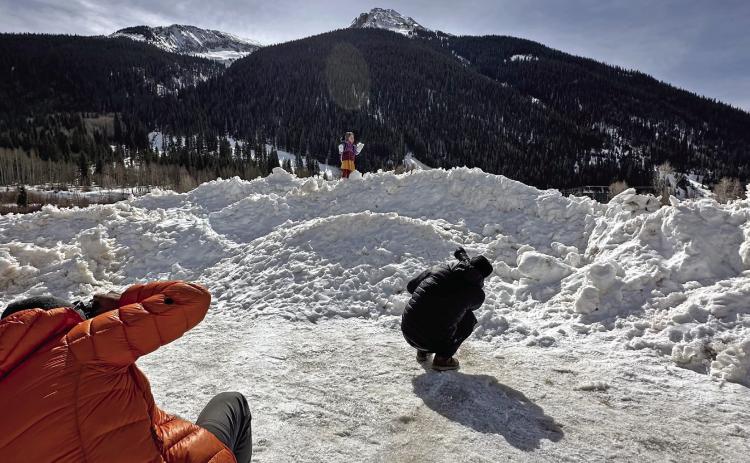 Photo credit Kahla Sorich Ava Andrade (who has a birthday today) posing on a snow hill in Silverton for Osprey photographers.