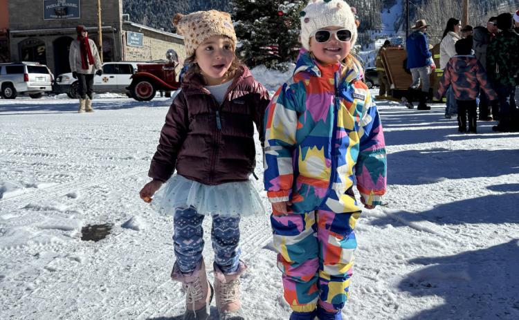 Ava Andrade (l) and Willow Blankenship (r) waiting in line to see Santa. Photo credit Katey Fetch