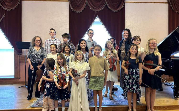 Photo credit Barbara Burtner Students of Lacey Black and Rebekah Soued-Weaver with their teachers at town hall recital.
