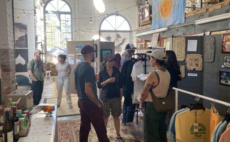 Folks enjoying the member art show August. Photo submitted by SPC