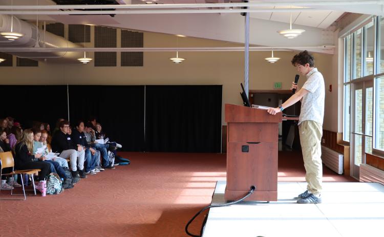 Jack Purcell starts the 7th annual youth summit with opening remarks and a land acknowledgement