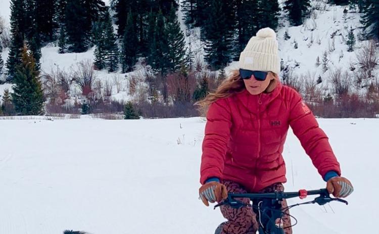 Kimmy Grant and her dog Oliver taking their daily fatbike ride on groomed trails. Photo credit DeAnne Gallegos