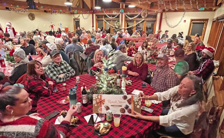The annual holiday potluck was a packed event. Photo credit DeAnne Gallegos