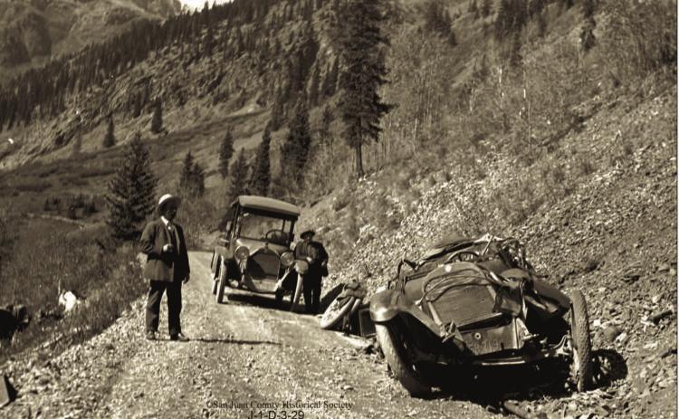 The wreckage of Will Ennis’ automobile on the roadway above Chattanooga. Two men are on the roadway. The man at right is Fred Patterson. The Ennis vehicle crashed on Wednesday, Oct. 5, 1921 Photo courtesy of San Juan County Historical Society
