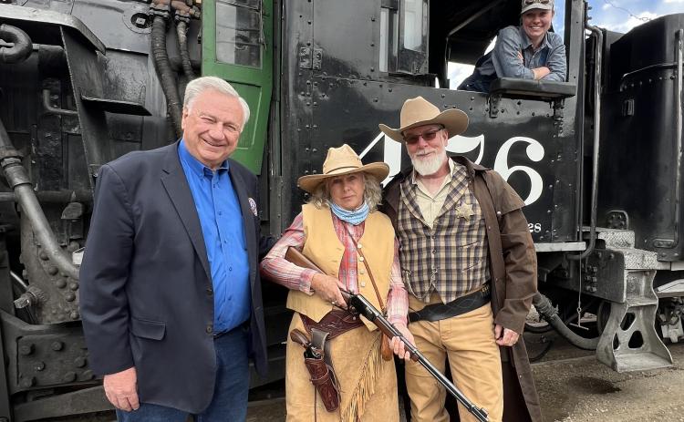 DSNGRR owner Al Harper poses with local Melodee Horton and San Juan County Sheriff Bruce Conrad for the first train in May of 2024. Photo credit DeAnne Gallegos