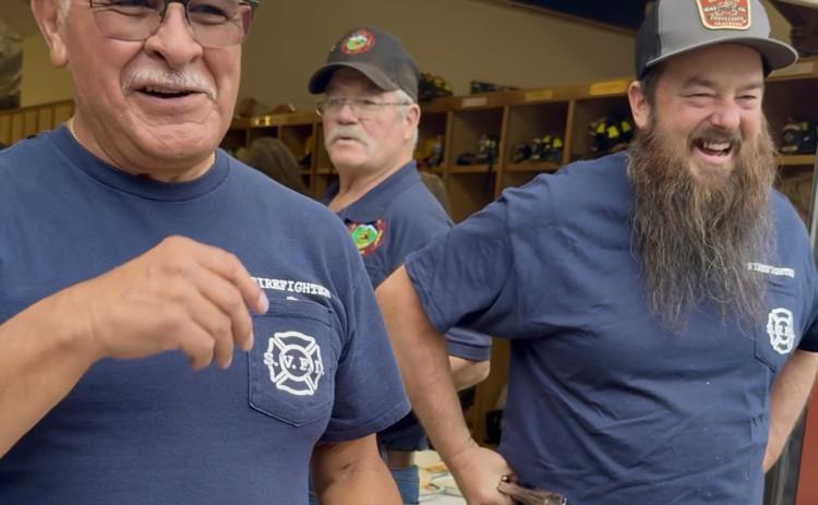 Fire Chief Gilbert Archuleta and Wayne were all smiles while grilling hot dogs and hamburgers during the 150th; Terry Rhoades is in the middle photo by DeAnne Gallegos