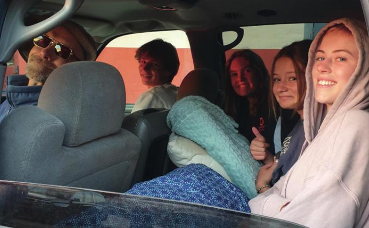 High School Students Meah Mordecai, Kharis Weller, Belen Roof, and Paton Edwards Load Up for the State Track Meet With Coach Dave Emory Photo Credit - Rob Roof