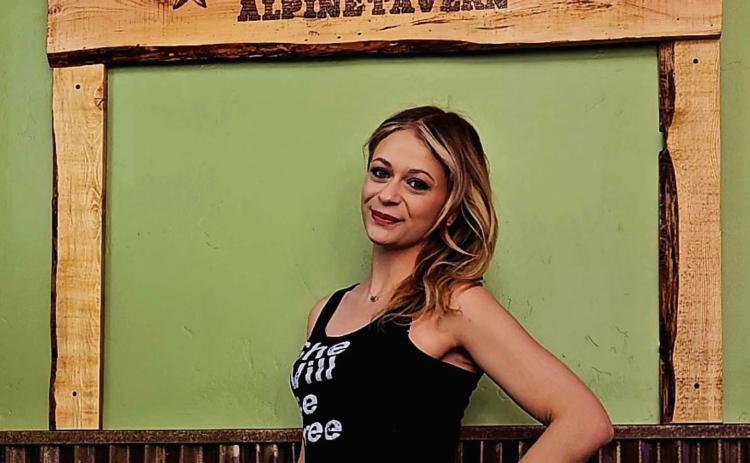 Alpine Tavern owner Shiloh Sams created a “selfie frame” that was built by longtime local Mike Geryak.
