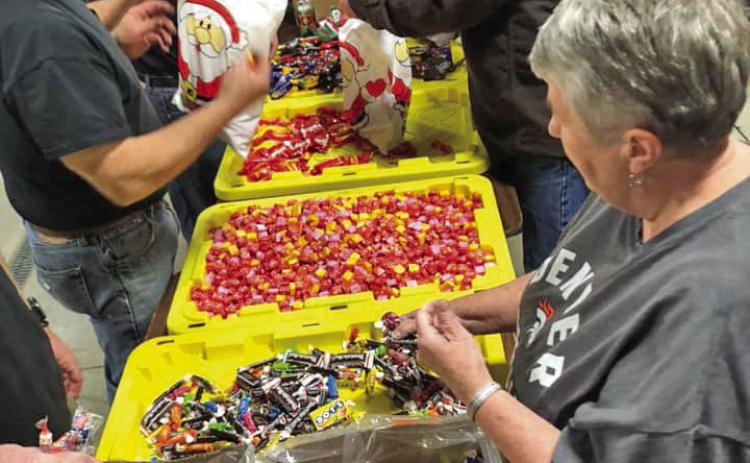 Getting Candy Ready For Christmas Eve Santa Visit. Photo by Silverton Fire Dept