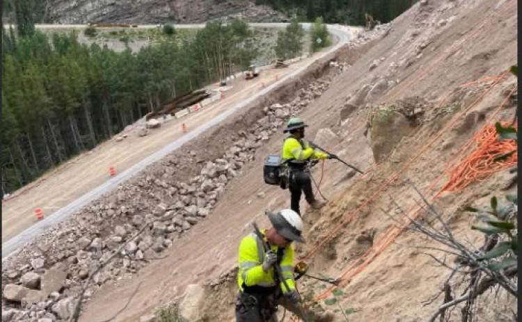 Crews working on rock wall. Photo by CDOT