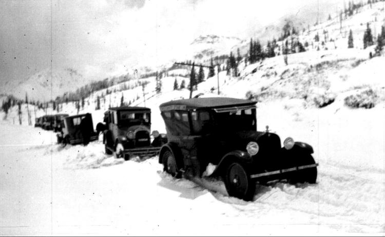 Photo courtesy San Juan County Historical Society The top of Red Mountain Pass, showing seven vehicles, one of which has turned around in the snow on June 5, 1924.