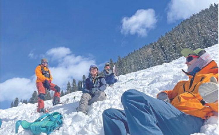 Resting after a successful practice rescue. From the right Cameron Crowell, Kelly Fetch, Erin Laine, and Kelly Weakley. Photo by Katey Fetch