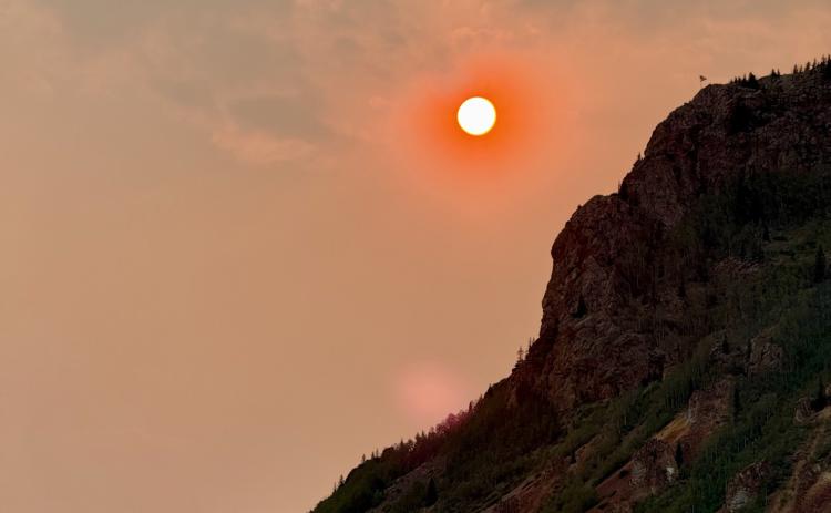Wildfire smoke from regional fires caused the sun to look like a bright orange orb in the sky photo by DeAnne Gallegos