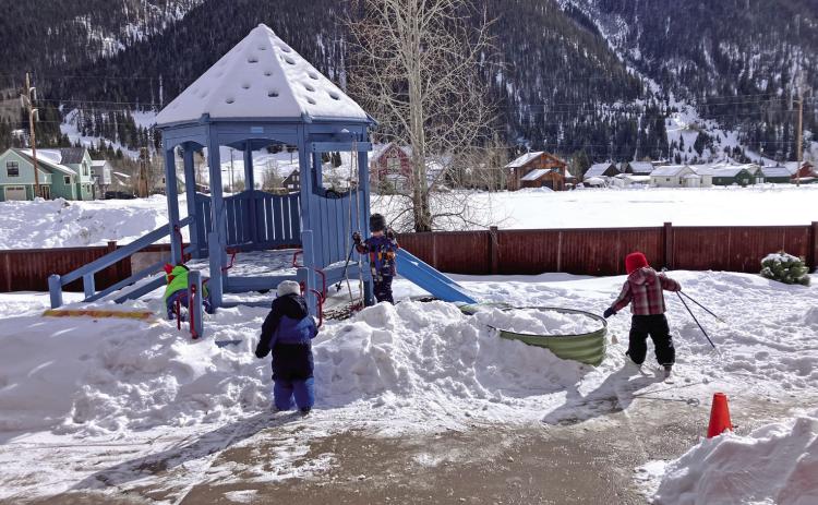 Photo credit Monica Watton The kids at SFLC playing on their snow-covered playground.
