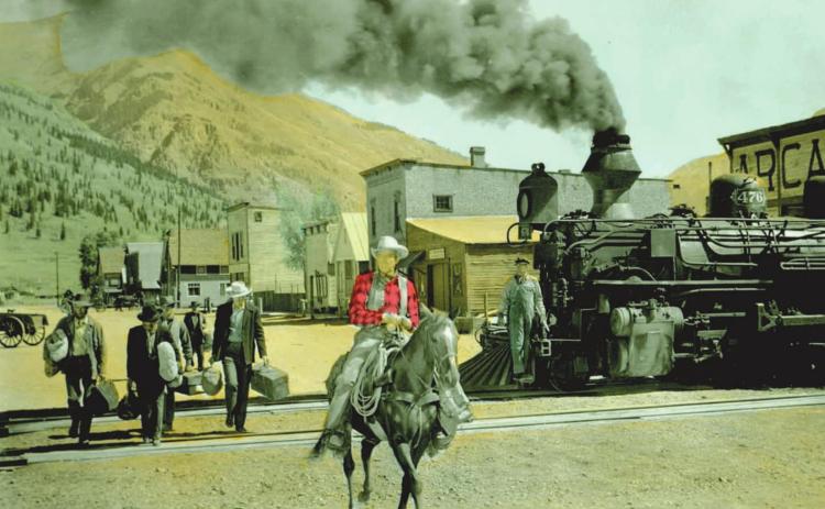 Actor Jimmy Stewart rides a horse down Blair Street in Silverton 65 years ago, during the filming of the movie “Night Passage,” at the corner of 12th Street and Blair. San Juan County Historical Society photo