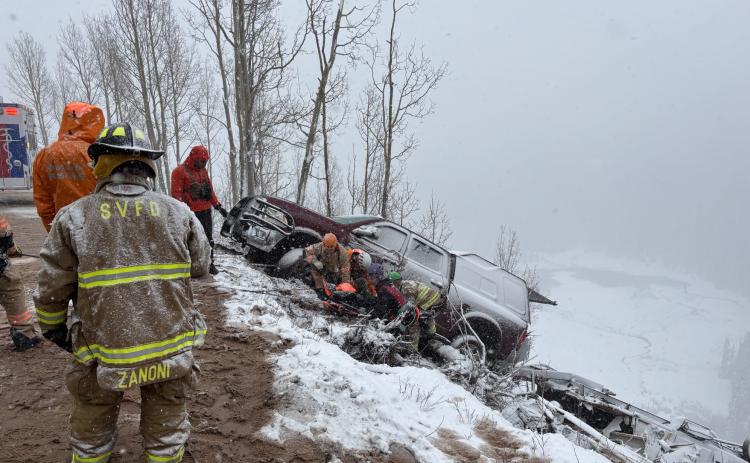 A photo of the vehicle and camper over the edge on highway 550. Photo credit Silverton Medical Resuce