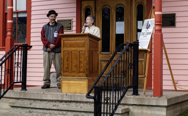 Society Chairman Beverly Rich and long- time board member and Treasurer Scott Fetchenhier dedicate a plaque to the late “ Zeke” Zanoni. Zanoni served on the board for many years and spearheaded the Society’s extensive efforts to preserve the local history of hard- rock mining.